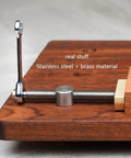 Close-up of Top Shelf Heavy Duty Brass And Aluminum Workbench Vice For Woodworking Tables Featuring Rust Resistant Stainless Steel Jaws.