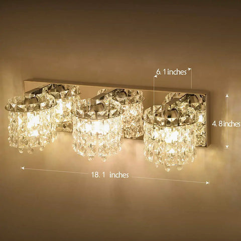 3 Light Vanity Light With Crystal Drops In Polished Chrome Finish illuminating wall with dimensions labeled