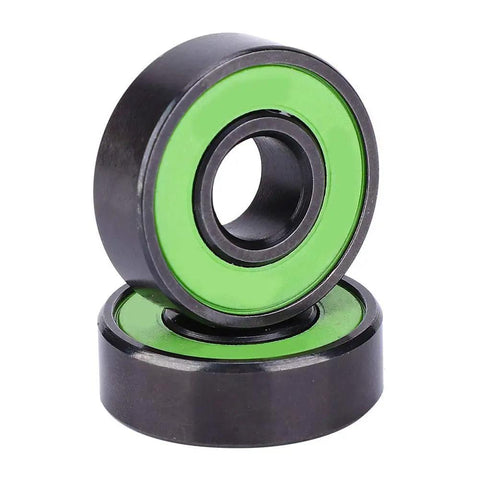 Premium Chrome Steel Skateboard Bearings With Extended Inner Ring For Zero Wobble And Razor Sharp Alignment, green and black design.
