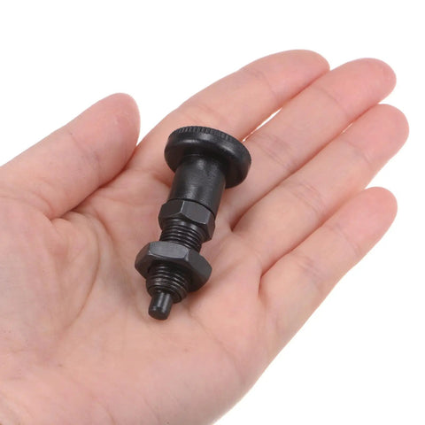 M10x1 Push Fit Ball Nose Spring Index Plunger With Retractable Location Pin And Return Knob in hand for size comparison.