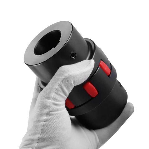 Gloved hand holding 45 Steel Flexible Shaft Coupling XL2 Type Jaw With Elastomeric Spider Bore 19 to 25mm for medium and large equipment.