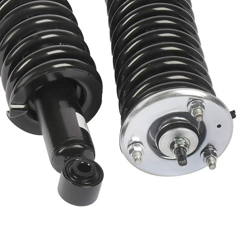 Close-up of Complete Strut Spring Assembly Shock Absorber For Nissan Frontier 2005 To 2014 Front And Rear Pair Set Of 4 Built For A Smooth Ride And Easy Install For DIY Enthusiasts No Hassle showing coil and mounting details