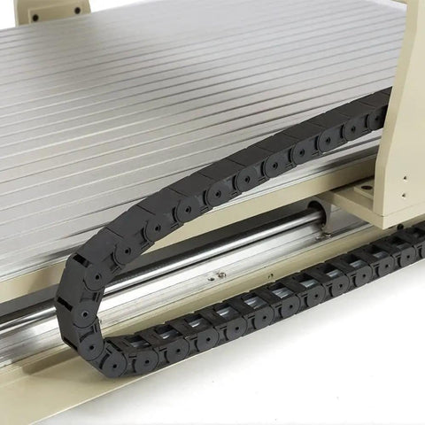 Detail of USB 4 Axis CNC 6090 Router Kit with 1500W water cooled spindle showing cable track on aluminum surface for industrial projects