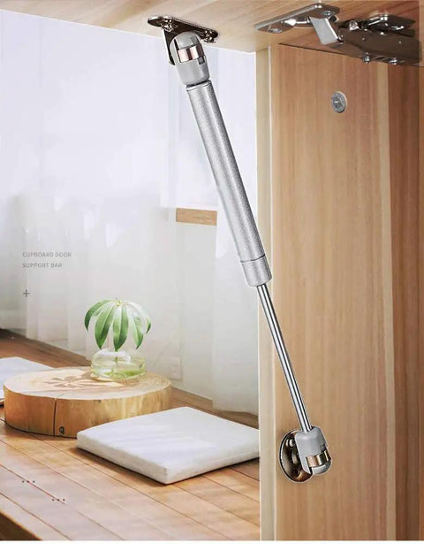 2 Pack 120N Gas Spring Strut Shocks For Cabinets And Toy Boxes with Soft Close Hinges installed on wooden kitchen cabinet lid