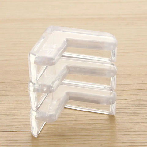 Stack of clear PVC Safe Corner Protectors For Furniture With Double Sided Adhesive Tape 30 Pack to minimize collisions.