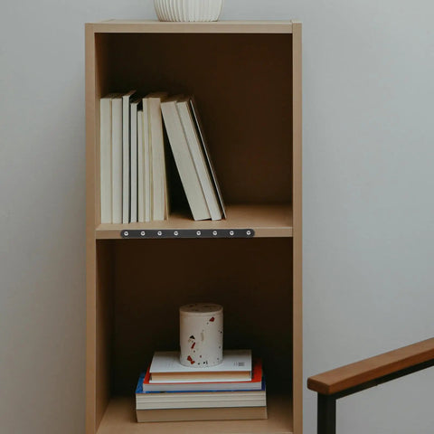 Bookshelf with books and candles reinforced with Beefy Stainless Steel Flat Brace Brackets Set for Wood Furniture Repair, 4 Pack.