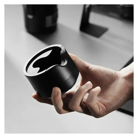Heavy Duty Adjustable 51 53 58 Millimeter Portafilter Holder Tamping Platform Crafted From Tough Aluminum hand-held for espresso preparation.