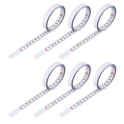 Six Pack Adhesive Flexible Tape Measures Set, 1m And 2m Lengths, laid out showing metric readouts, self sticking for home projects.