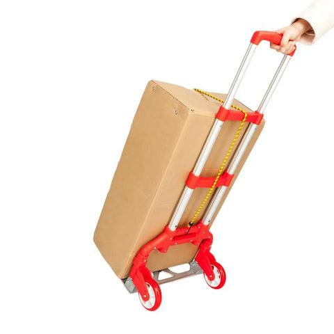 Slick Folding Hand Truck Dolly With 165 Lb Capacity And Telescoping Handle Dang Lightweight Portable Cart With Smooth Rubber Tires carrying a cardboard box.