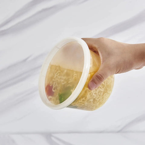 Hand holding 16-Ounce To-Go Food Storage Containers With Lids, BPA Free, Leakproof Microwave Safe, Stackable Grab-And-Go Meal Prep Boxes