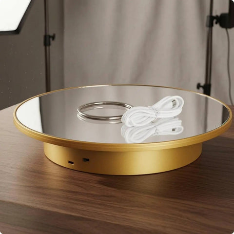 Premium Electric Rotating Display Stand With Smooth 360 Spin For Online Sellers And Photographers, featuring a mirror gold finish and power cord.