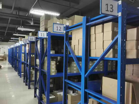 Warehouse shelves with boxes storing Micro850 PLC 2080-LC50-24AWB Compact Programmable Logic Controller New In Box With One Year Warranty
