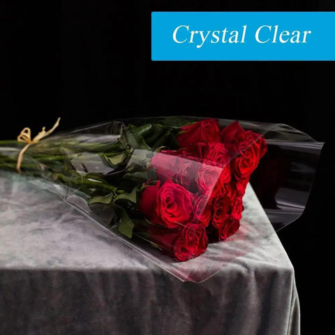 Bouquet of red roses wrapped in Wide 17.5 Inch Clear Cellophane Wrap Roll, 50 Feet Long, 3 Mil Thick, Slick For Gift Wrapping.