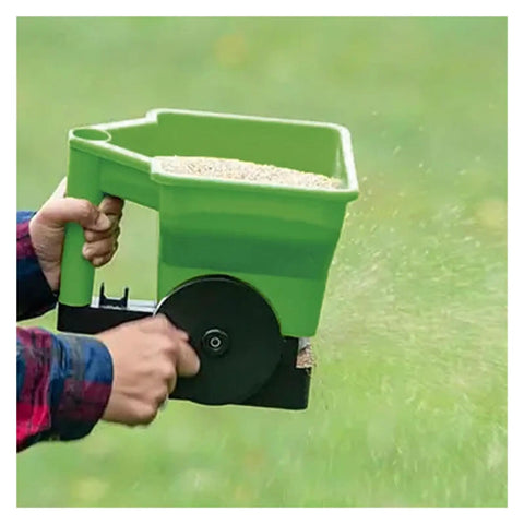 Grab And Go Handheld Grass Seed And Fertilizer Spreader For Portable Manual Lawn Garden Seeding in use spreading seeds