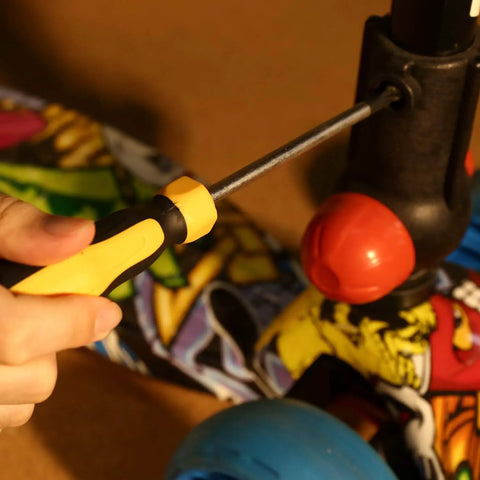 Using screwdriver from Must-Have All-In-One 198 Piece Home Repair Tool Kit With Plastic Toolbox For DIY Projects on scooter