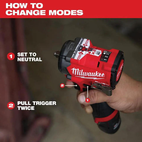 Hand holding M12 FUEL Stubby Half Inch Impact Wrench With 550 Ft Lbs Torque showing how to change modes