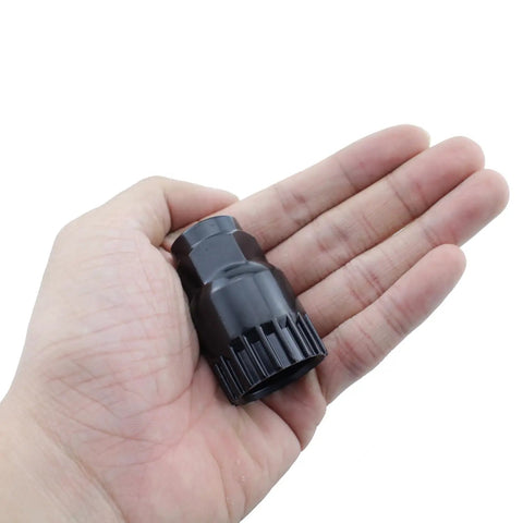 Hand holding Mountain Bike Center Shaft Tool Crank Remover For 20 Tooth Bottom Bracket Removal Tool Heavy Duty High Carbon Steel