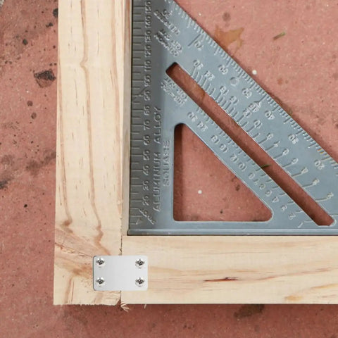 Stainless Steel Flat Brackets With Screws 20 Pack For DIYers And Home Upgrades installed on wooden frame corner.
