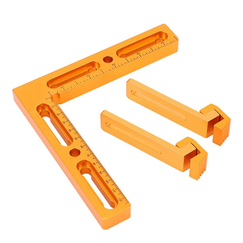 Precision Built T Slot Perforated Table System With Heavy Duty Aluminum Vise Clamps And Dope CNC Workpiece Positioning Fixture For Quick Milling Setup And No Sweat Engraving, orange metal square and clamps.