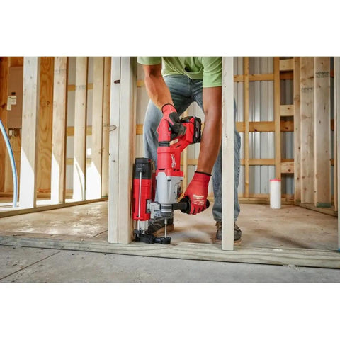 Top Shelf Brushless M18 Rotary Hammer With D Handle And Sds Plus Chuck in use drilling a hole in wooden framework.