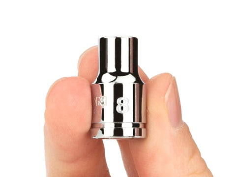 Close-up of hand holding a 8mm socket from Pro Grade DIY Ready Three Eighths Inch Drive Twelve Point Socket Set, Thirty Four Piece