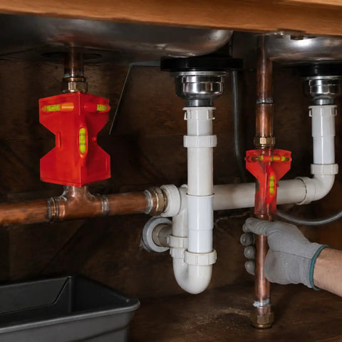 Spirit Level, Foldable Pipe, Adjustable Angle Pipe Corner Gauge used under a sink for plumbing installation.