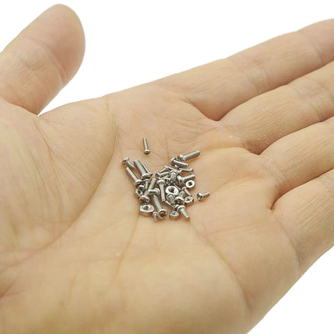 TopShelf Phillips Pan Head Machine Screws And Hex Nuts Metric Assortment Kit Featuring 850Pieces Of JobsiteGrade Stainless Steel Hardware For NoFuss Daily Repairs in a hand.