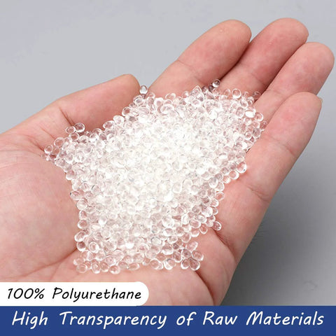 Clear polyurethane plastic pellets held in an open palm