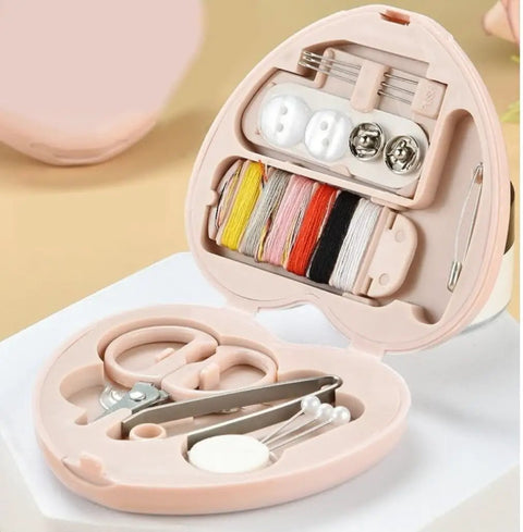 Compact Travel Sewing Kit Two Pack Featuring Adorable Heart Shaped Cases Pink And Blue, open kit showing threads, scissors, and needles.