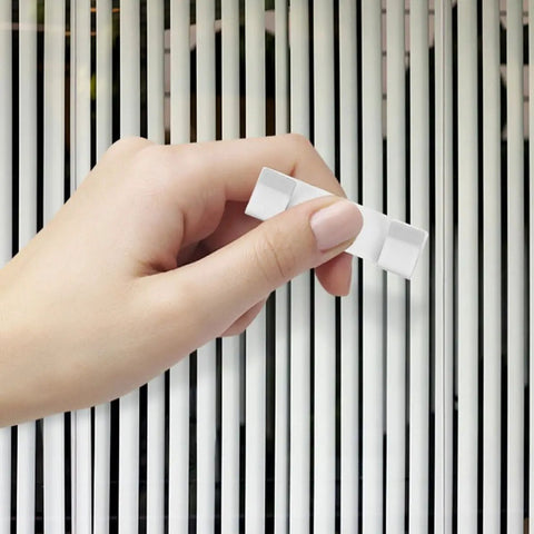 10 Pc Vertical Blind Repair Tabs Heavy Duty Metal Vane Savers Universal Fit held in hand, ready for installation on vertical blinds.