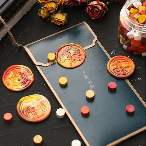 Top Shelf Octagon Sealing Wax Beads With Clear Case For Letters Cards And Invitations Melts Clean Without Stress To Craft Slick Seals That Slap On Every Package. Gold sealing wax stamps on blue envelope with colorful wax beads.