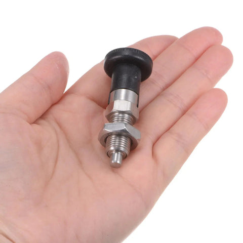M10x1 Double Pack Ball Nose Spring Plungers Crafted From Badass Stainless Steel For Slick Self Locking Action and Zero Hassle Indexing Performance On Heavy Duty Industrial Projects in a hand.
