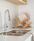 High Arc Pull Down Kitchen Faucet With 3 Function Sprayer And POWERinse Technology installed in modern kitchen, chrome finish.