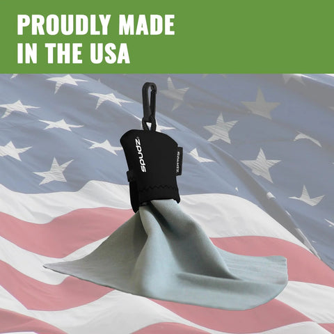 Front view of Amazon SPUDZ microfiber screen cleaner with carabiner clip and gray cloth against flag background