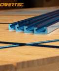 Rock Solid 24 Inch Double Cut Universal T Track Kit With Bidirectional Short Stops And Wing Nuts Shop Ready Heavy Duty Aluminum Slot Rail System For Table Saw Jigs And Router Table Setup, showing four aluminum tracks on wood.