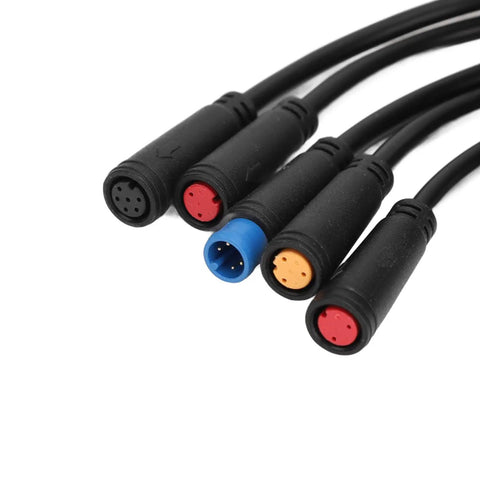 Close-up of durable waterproof electric bike connector cables with color-coded plugs for mods and custom builds, ABS construction.