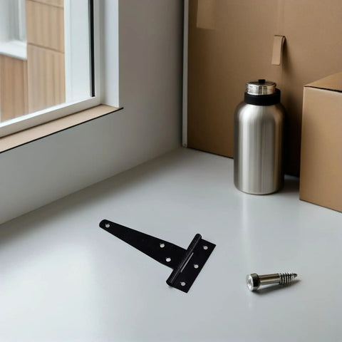 Eight-Piece Black Zinc Alloy T-Shaped Gate Hinges With Triangular Support for Wood and Metal Doors on white surface