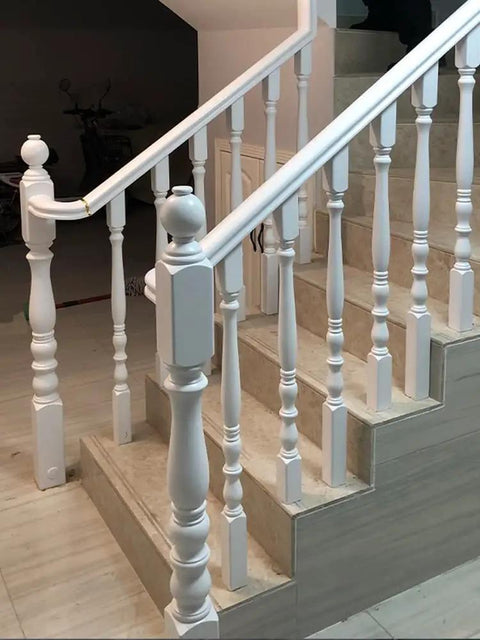 White Wooden Balusters Top Tier Quality with solid poplar material on staircase, showcasing classic design for easy DIY install.