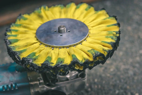 Close-up of a buffing wheel from Aluminum Polishing Kit With Dual Buffing Wheels Polishing Compounds Right Angle Grinder Safety Flange Pro Red Hand