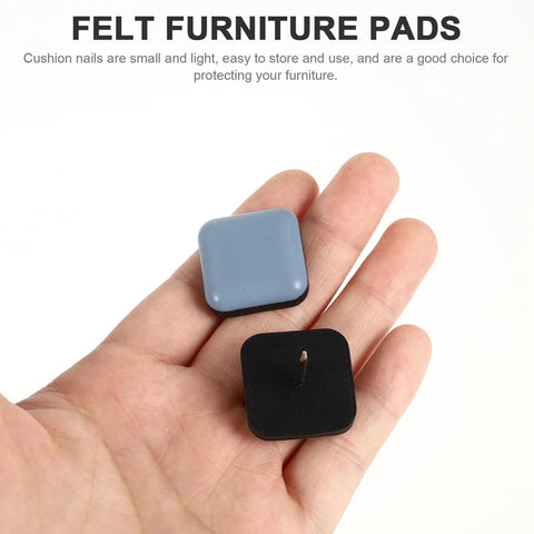 Hand holding two felt furniture pads for floor protection, related to 16 Pieces Chair Glides With PTFE And Iron Floor Protectors