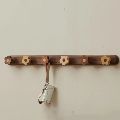 Dang Cute Flower Peg Wall Mount Coat Rack For Kids Crafted From Solid Walnut Wood Storage with flower-shaped hooks for keys.