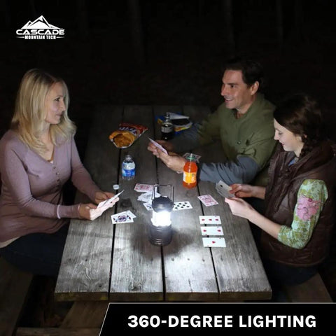 Family playing cards illuminated by Pop-Up LED Lantern 100 Lumen, 360 Degree Bright Light, IPX4 Water Resistant, Two-Pack at night
