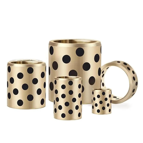 Built Tough Brass Graphite Flange Bearing Sleeve Bushing set with polka dots, sizes from small to large, for low friction movement.