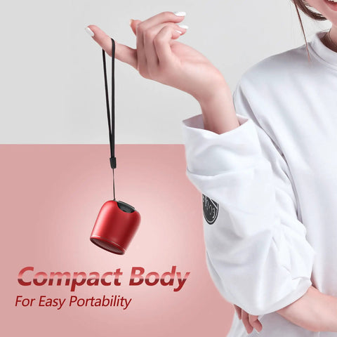 Compact Waterproof Bluetooth Speaker With Big Sound, Portable Mini Wireless Speaker in red hanging by a strap from a hand