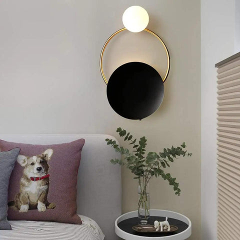 Fresh Modern LED Wall Sconce With Sturdy Iron Body, Up And Down Illumination Creates A Chill Ambient Vibe For Bedrooms, Bathrooms Or Halls, Warm Wash Light Is An Instant Upgrade For Any Home Setup Today mounted above a bed with a decorative pillow and plants.