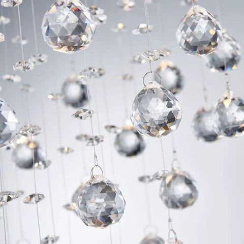 Close-up of crystal glass droplets on a Lit Modern Crystal Round Raindrop Chandelier Flush Mount LED Ceiling Light Fixture