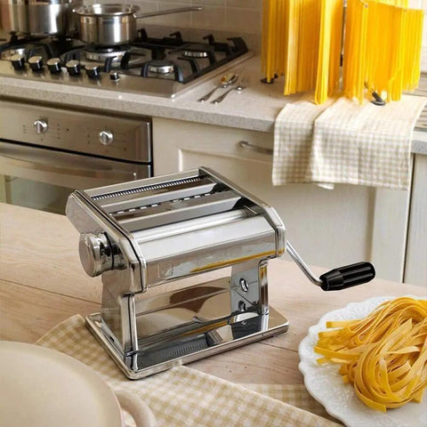 Automatic Electric Noodle Maker And Dough Roller For Home Kitchen Easy Thick Pasta Press with fresh fettuccine on a plate.