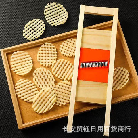 Manual stainless steel wave cutter for crinkle-cut potatoes and vegetables; wooden frame with orange guide.