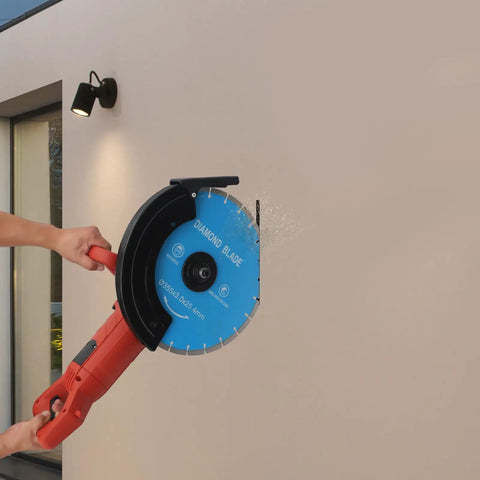 Heavy Duty 14 Inch Circular Concrete Saw With 3000 Watt Electric Motor And Tough As Nails Build For Ripping Through Masonry Machines Featuring Deep Five Point Three One Inch Cutting Depth in action cutting a wall.