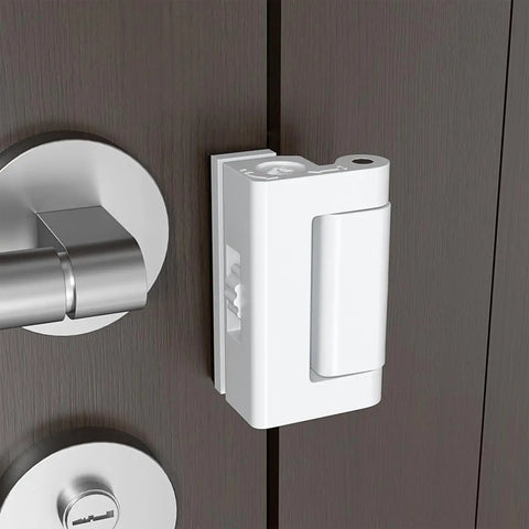 White Adjustable Portable Door Lock Rock Solid Security Reinforcement For Hotels Dorms mounted on a wooden door.